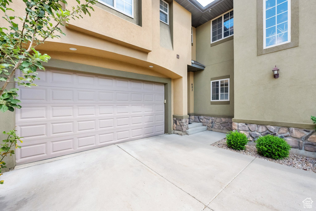 Garage featuring driveway