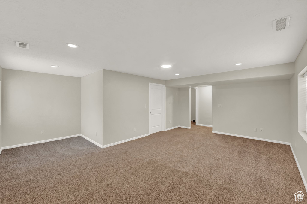 Finished below grade area with carpet floors and recessed lighting