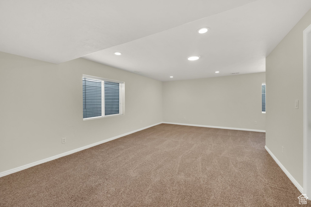 Spare room with carpet and recessed lighting