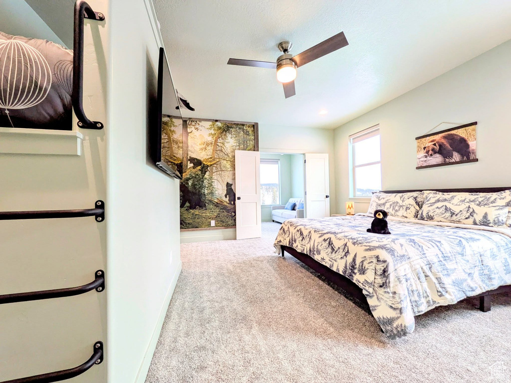 Bedroom with carpet flooring and a ceiling fan