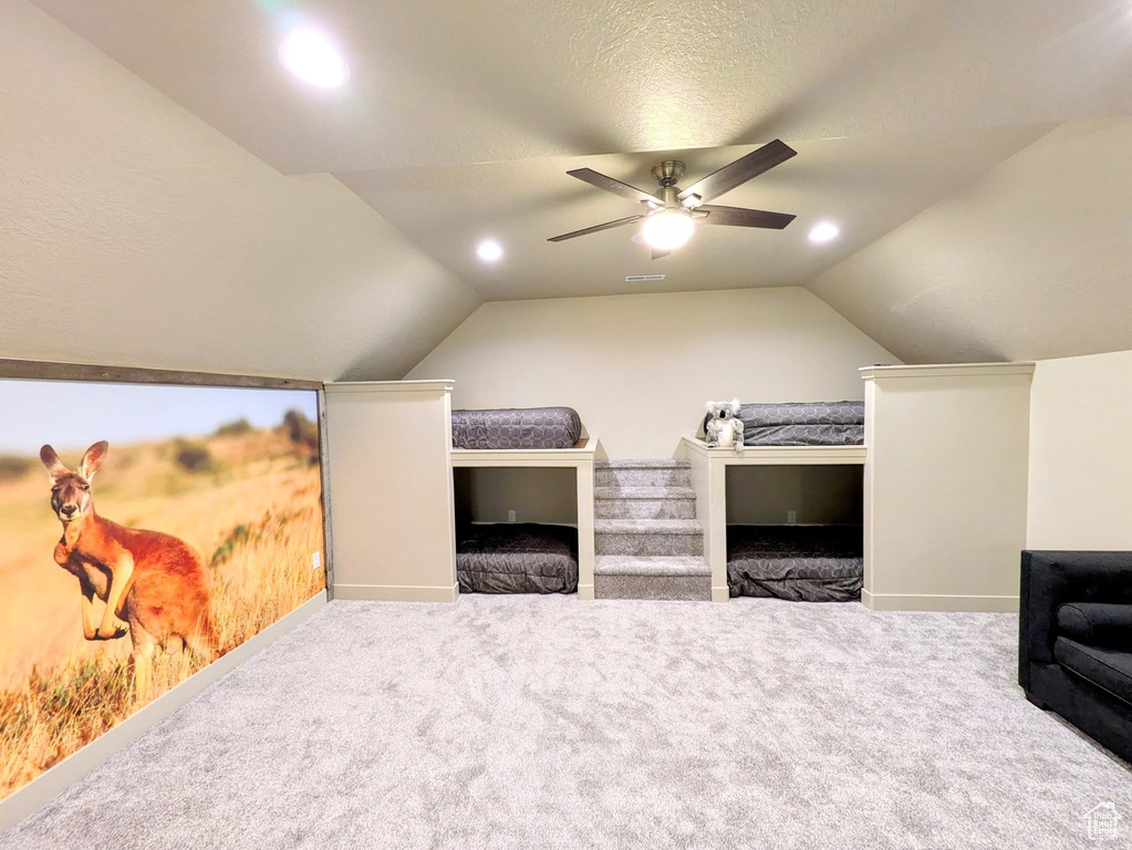 Bedroom featuring vaulted ceiling, carpet, ceiling fan, and recessed lighting