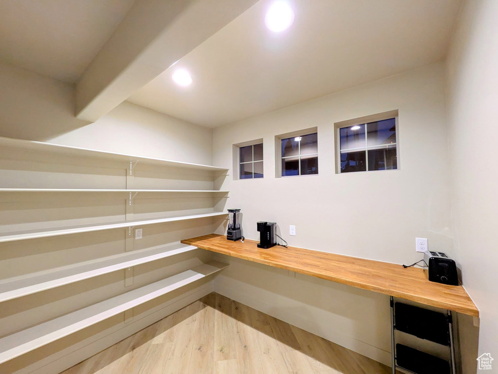 Unfurnished office featuring wood finished floors and recessed lighting