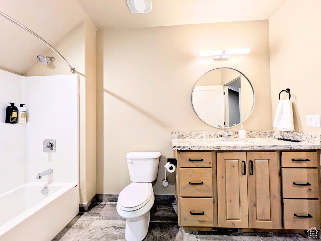Bathroom with vanity and  shower combination