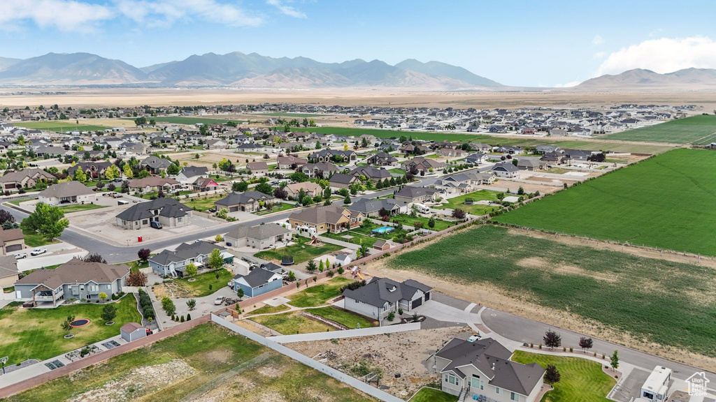 Aerial perspective of suburban area featuring a mountainous background