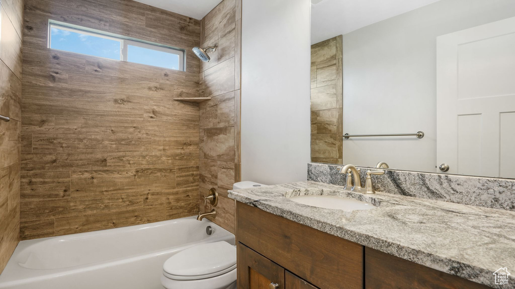 Full bath with vanity and shower / bath combination