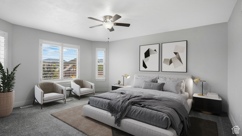 Bedroom with carpet and a ceiling fan