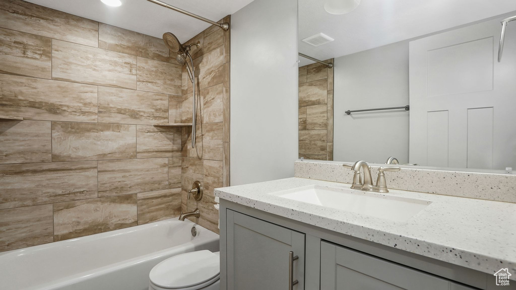 Full bath with vanity and shower / bath combination