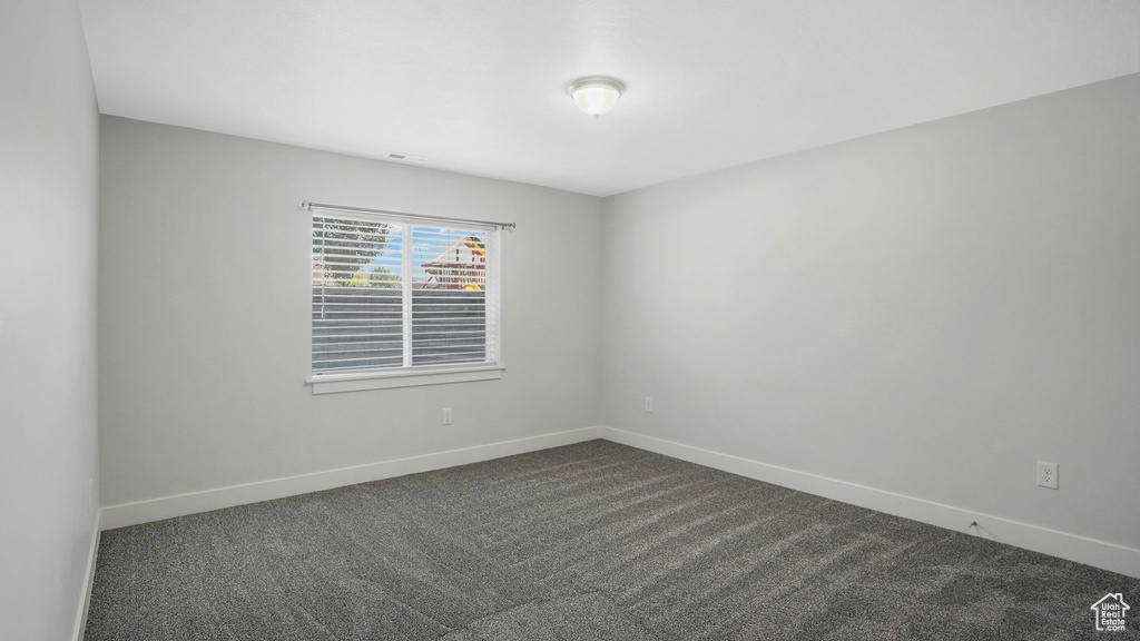 Empty room with dark carpet