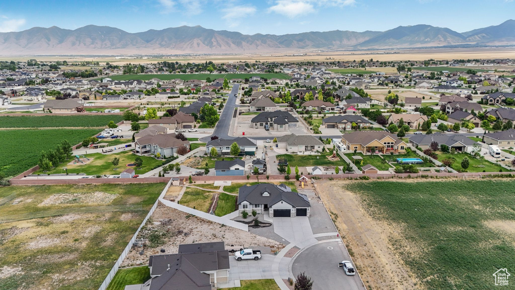 Aerial perspective of suburban area with a mountainous background
