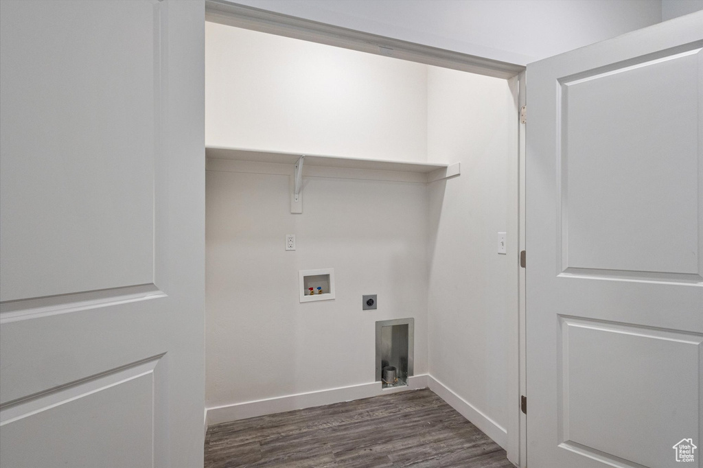 Laundry area featuring hookup for an electric dryer, dark wood finished floors, and washer hookup