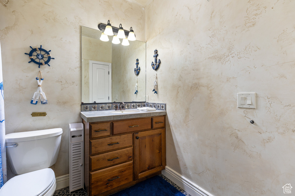 Bathroom featuring vanity and toilet