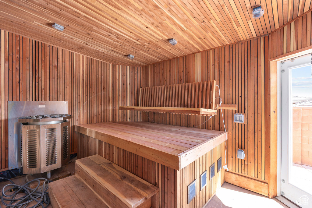 Sauna / steam room featuring wood walls and wood ceiling
