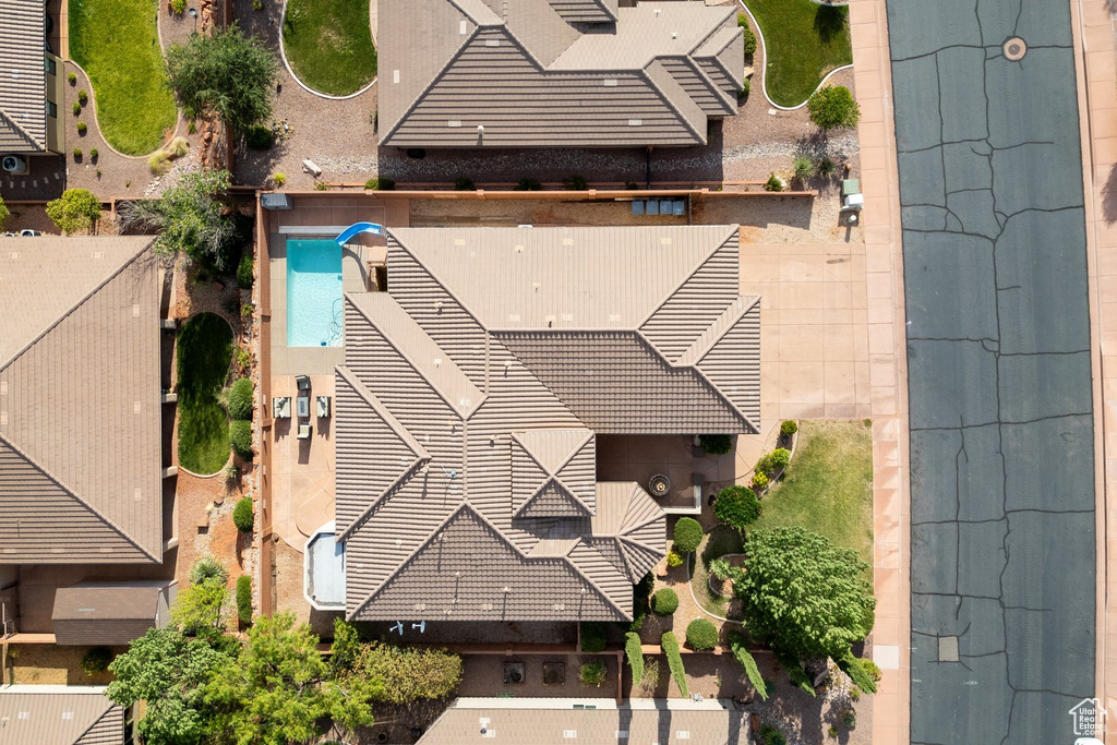 Aerial view of property and surrounding area with a pool area
