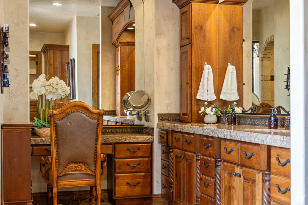Bathroom with vanity and recessed lighting