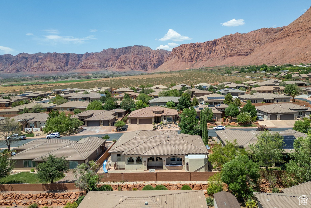 View of mountain backdrop featuring nearby suburban area