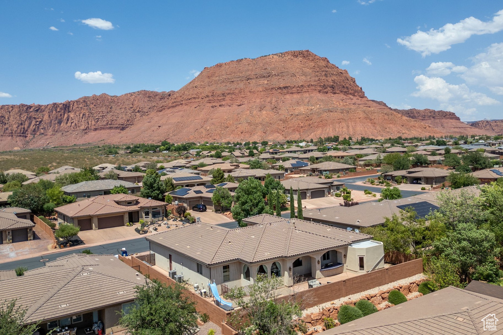 View of mountain backdrop featuring nearby suburban area