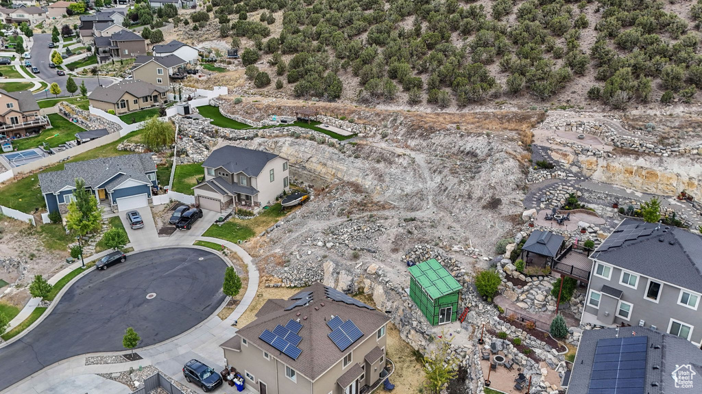 Aerial overview of property's location with nearby suburban area