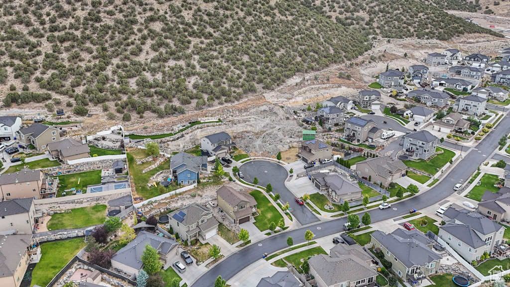 Aerial overview of property's location featuring nearby suburban area