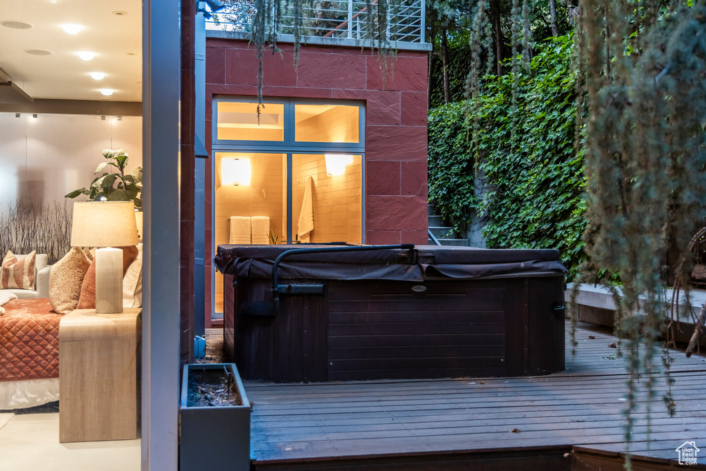 Wooden terrace with a hot tub