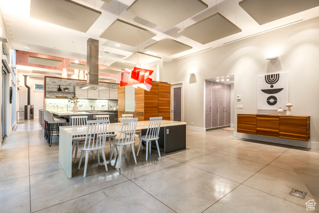 Dining room featuring coffered ceiling and a towering ceiling