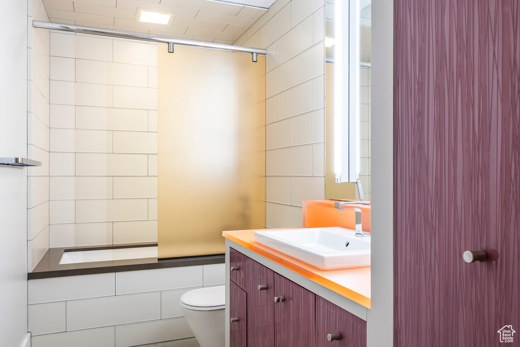 Full bath with vanity and a shower