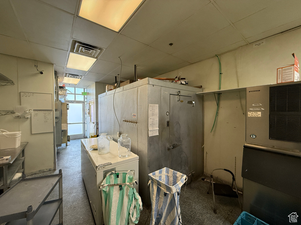 Bathroom featuring a paneled ceiling and walk in shower