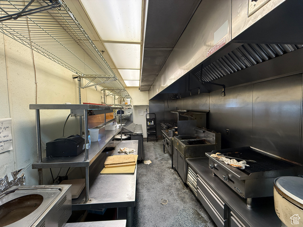 Kitchen featuring unfinished concrete floors