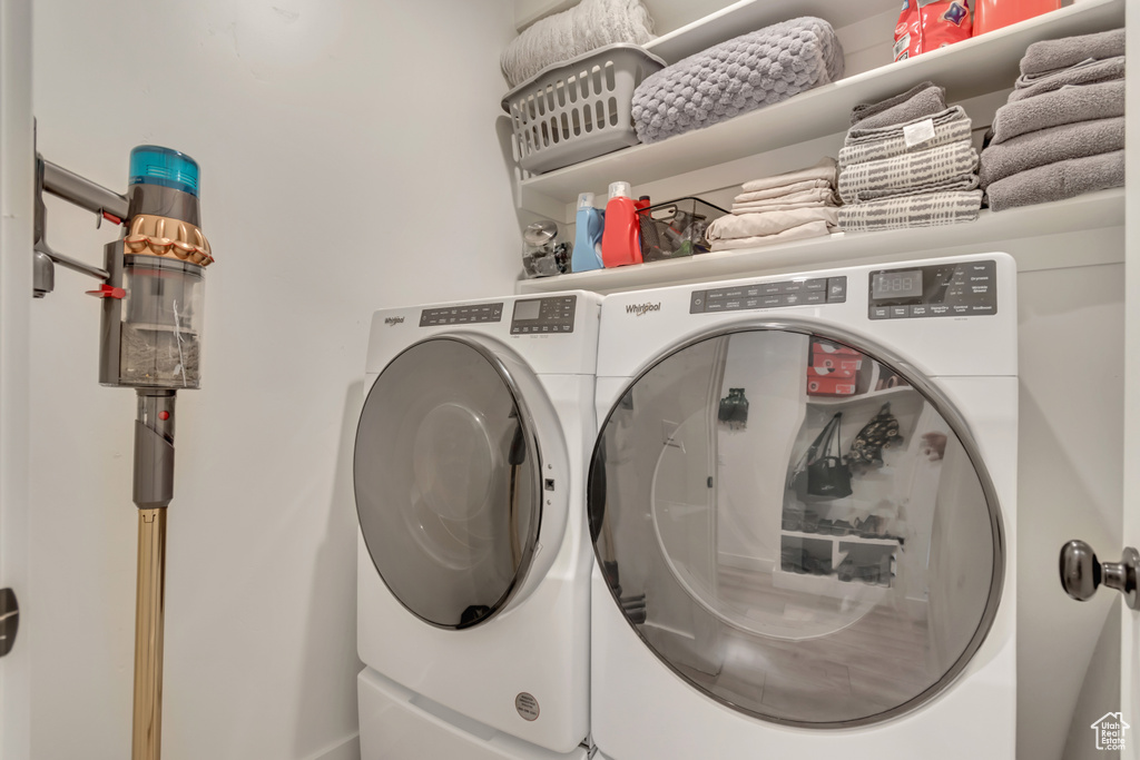 Washroom featuring washer and dryer
