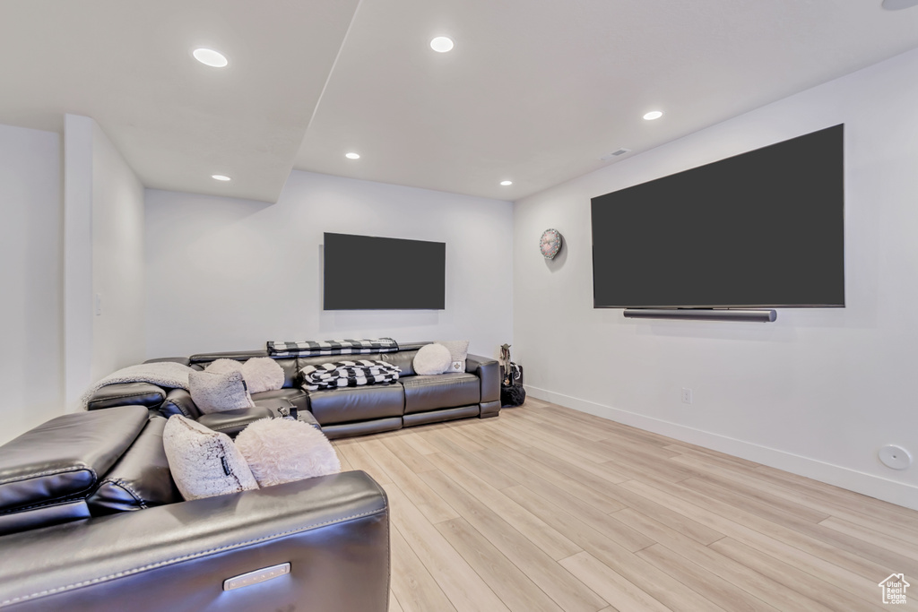 Living room featuring light wood-style floors and recessed lighting