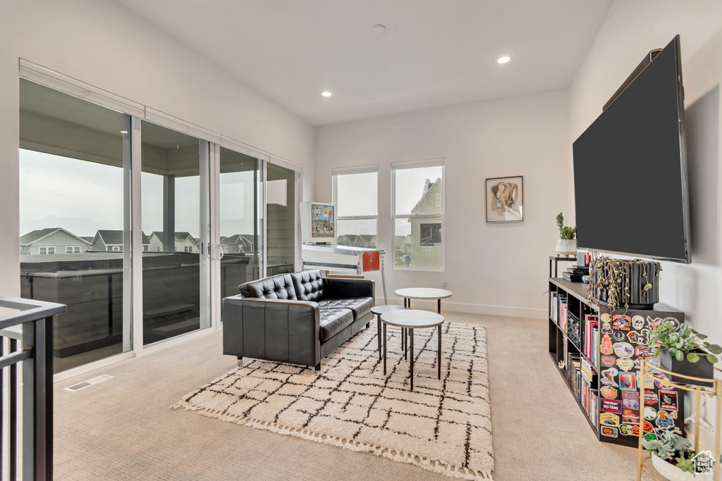 Living room featuring carpet floors and recessed lighting