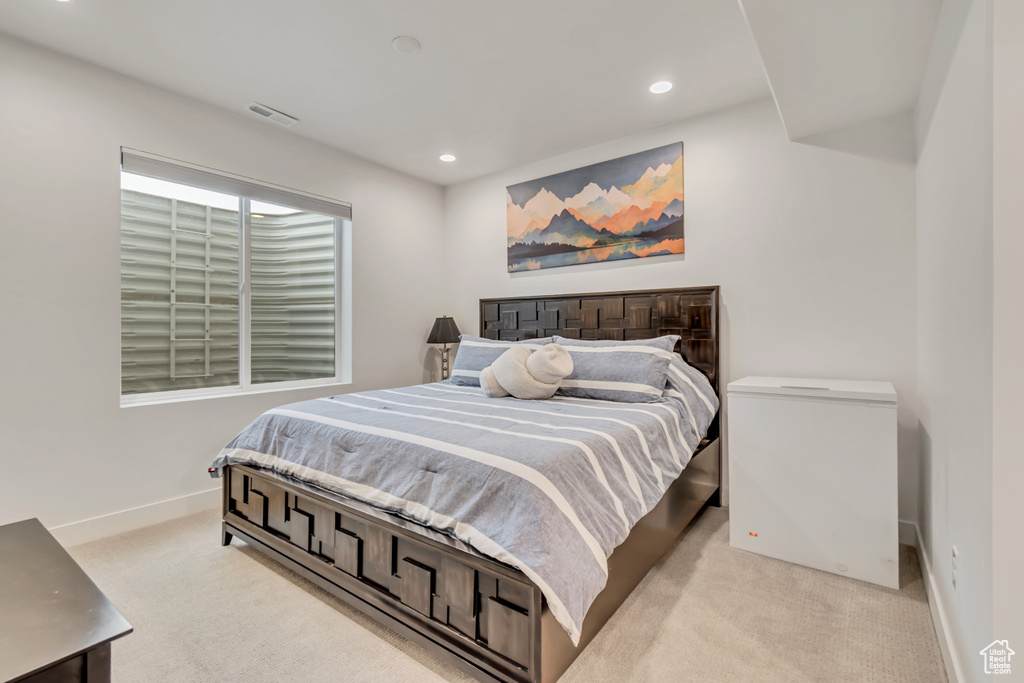 Bedroom featuring light carpet and recessed lighting