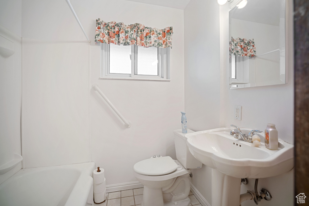 Full bath with tile patterned flooring, a bathtub, and a shower
