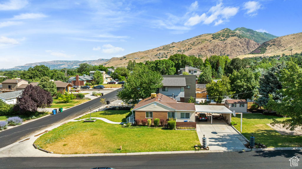 View of mountain background featuring nearby suburban area
