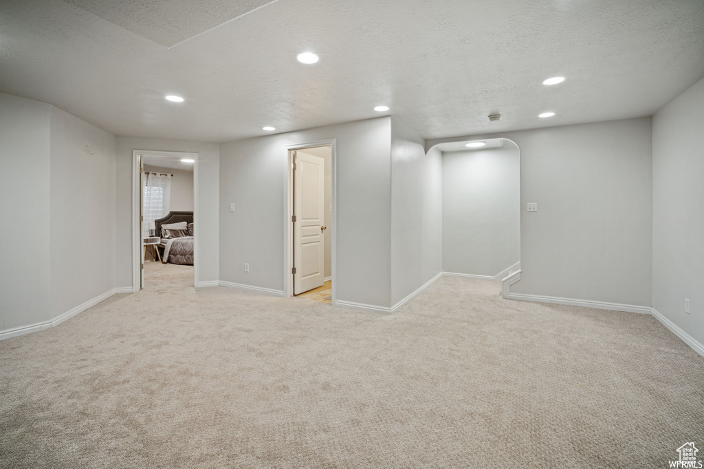 Basement featuring light carpet and recessed lighting