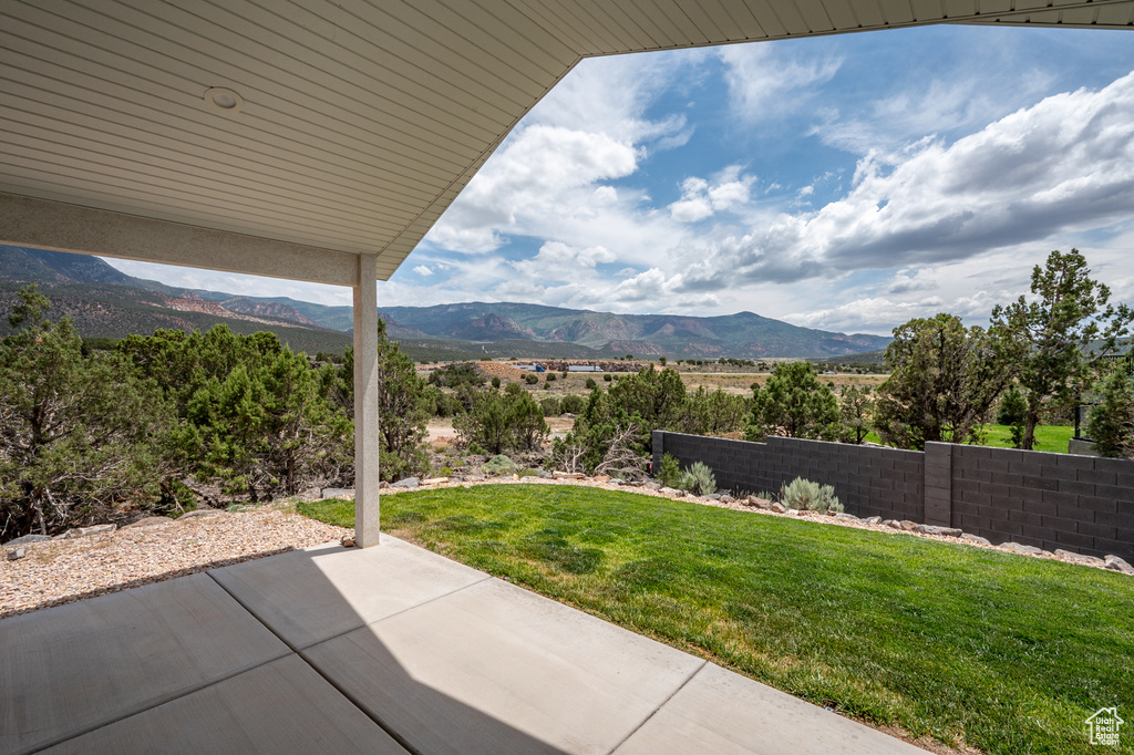 View of yard featuring a patio and a mountain view