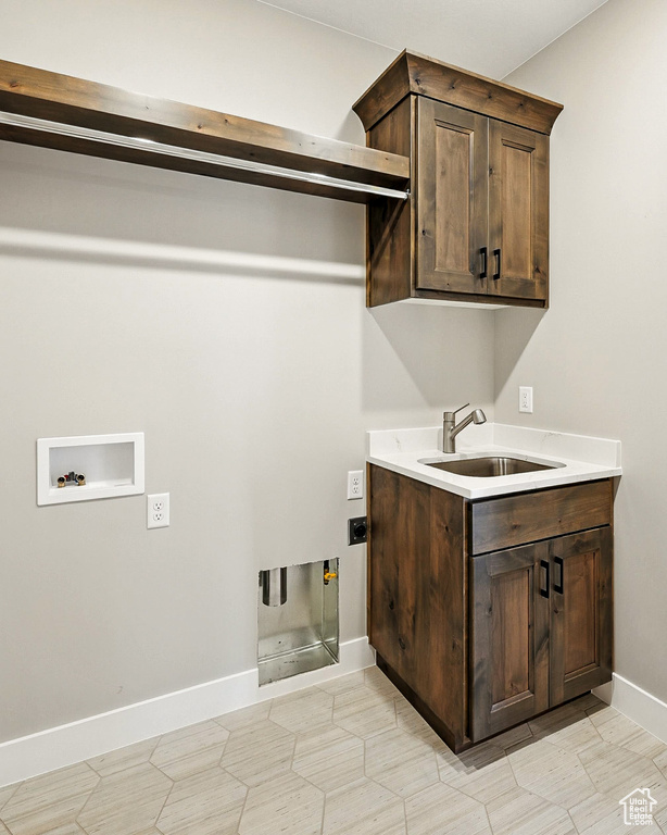 Laundry area with washer hookup, cabinet space, and electric dryer hookup
