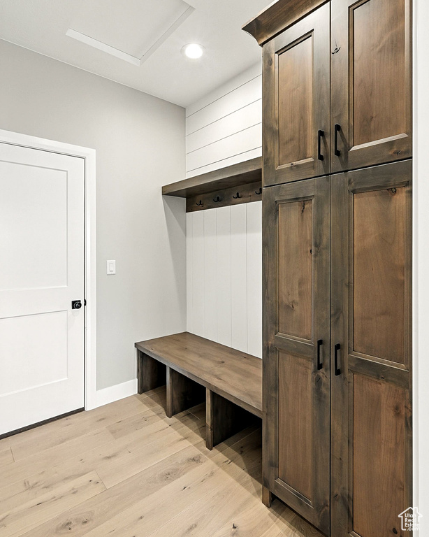 Mudroom featuring light wood-style flooring and recessed lighting