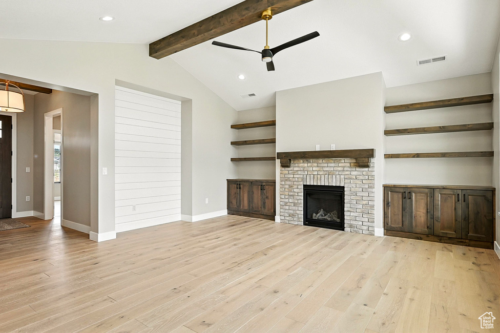 Unfurnished living room with light wood-style flooring, ceiling fan, recessed lighting, and a fireplace