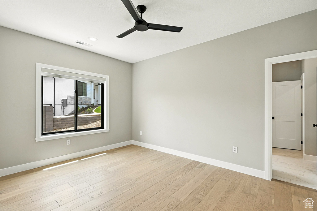 Unfurnished room featuring ceiling fan, light wood-type flooring, and recessed lighting