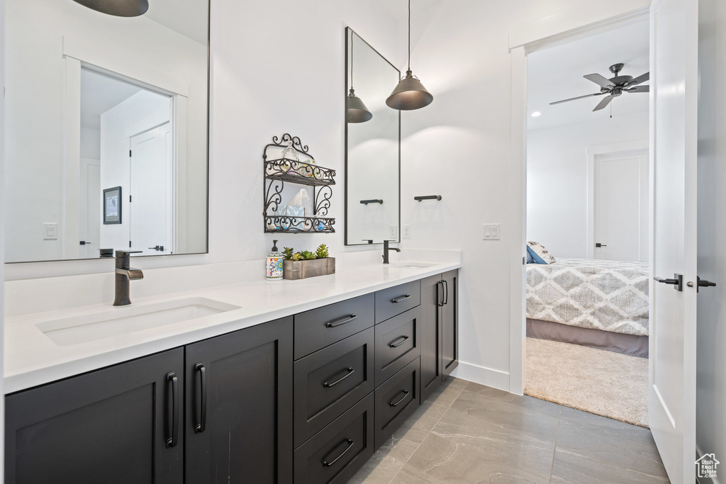 Ensuite bathroom with double vanity and ceiling fan