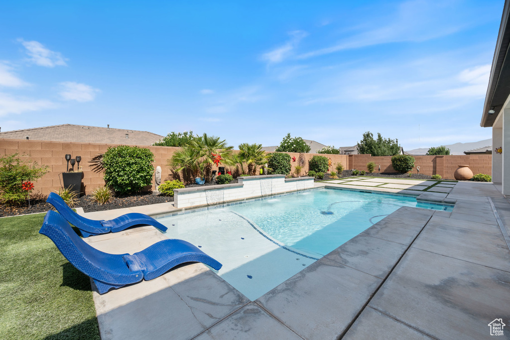 View of pool featuring a fenced backyard and a patio area