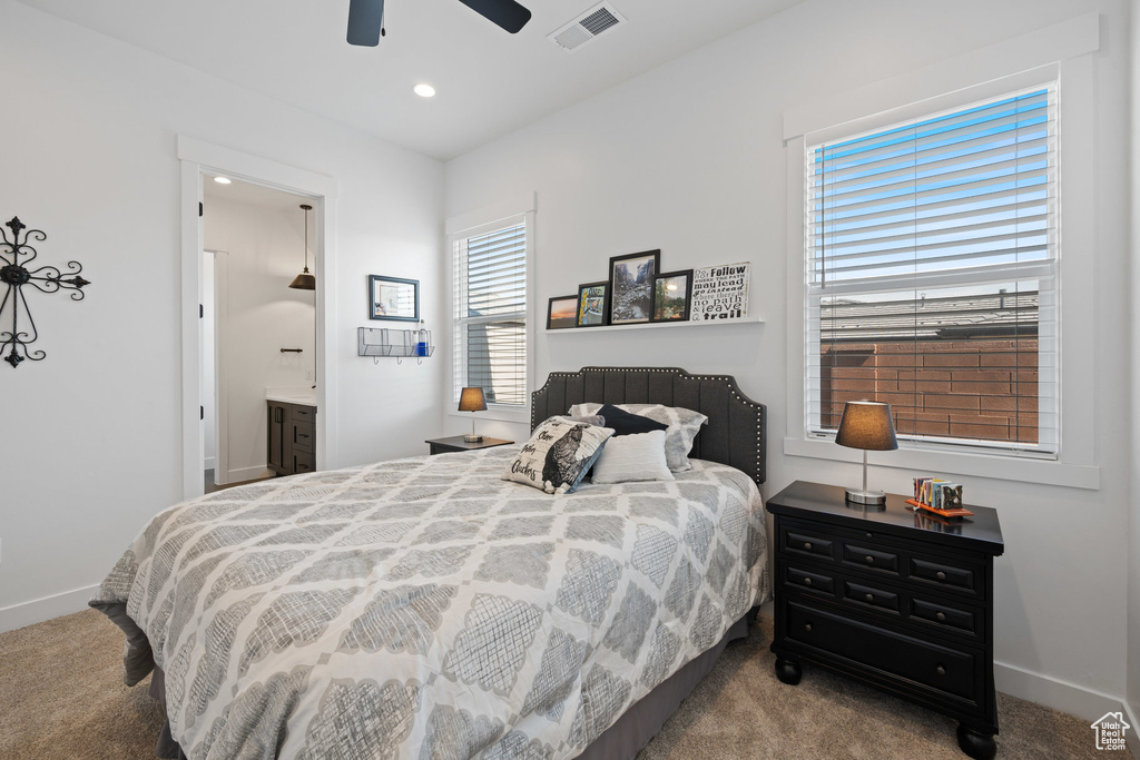 Bedroom with carpet, recessed lighting, ceiling fan, and connected bathroom