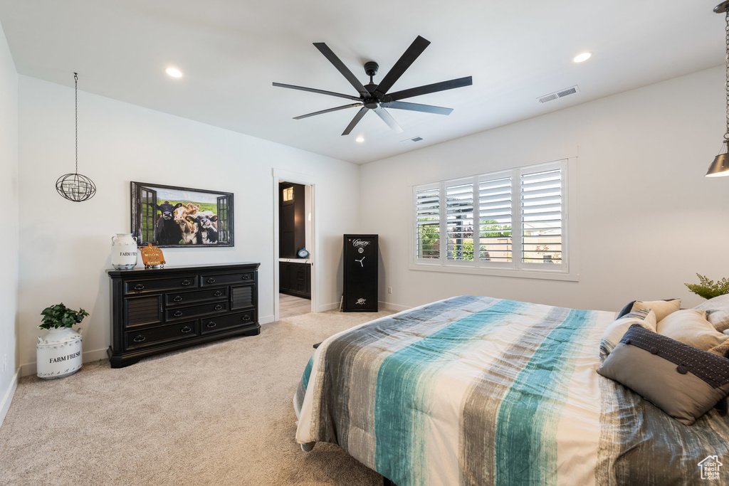 Carpeted bedroom with recessed lighting, connected bathroom, and ceiling fan