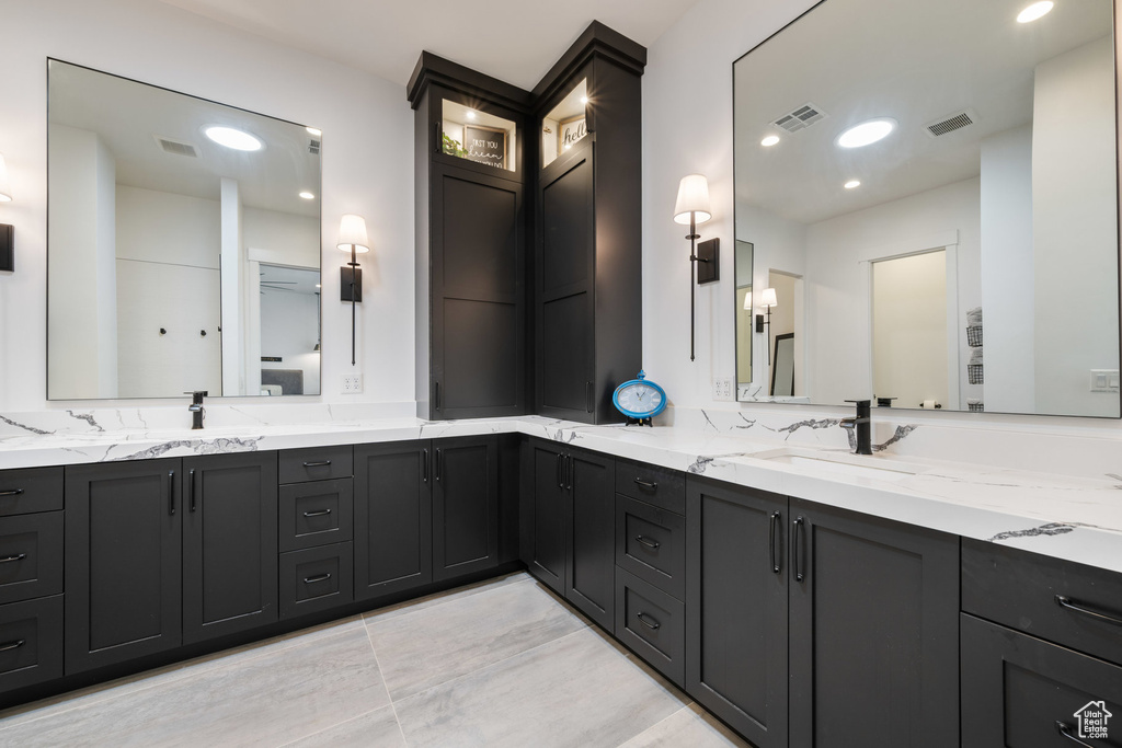 Bathroom featuring double vanity and recessed lighting
