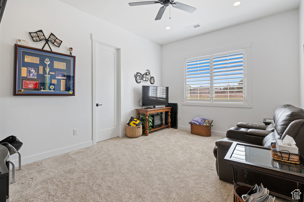 Living room with a ceiling fan, carpet, and recessed lighting