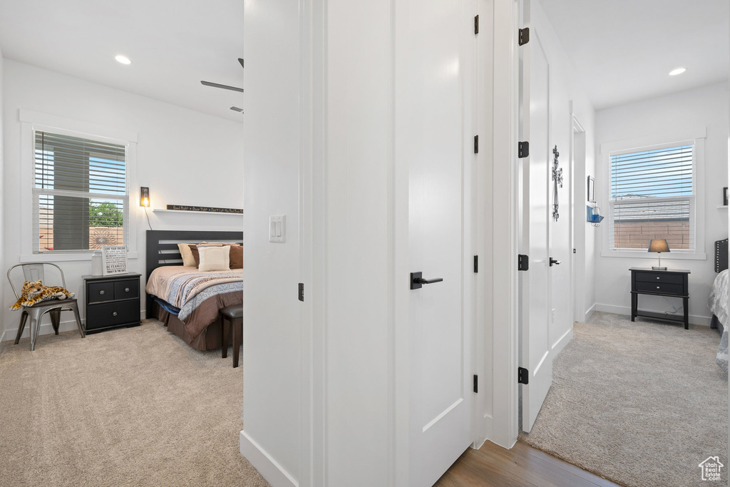 Carpeted bedroom with recessed lighting