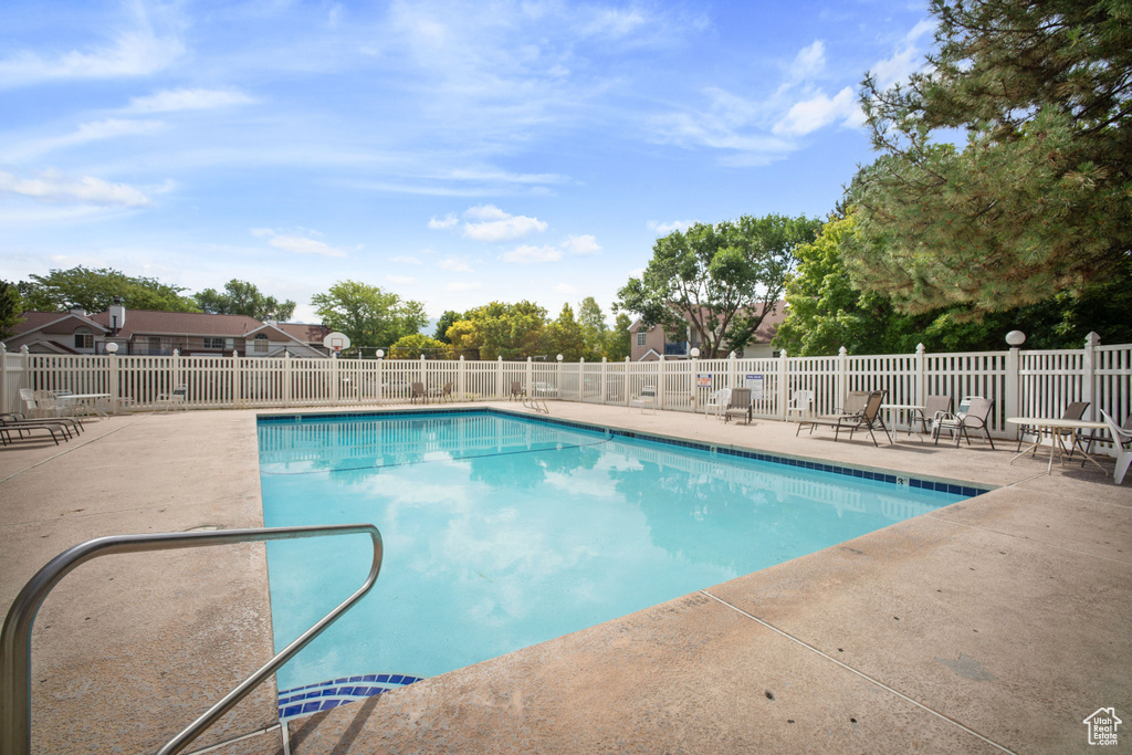 Community pool with a patio area