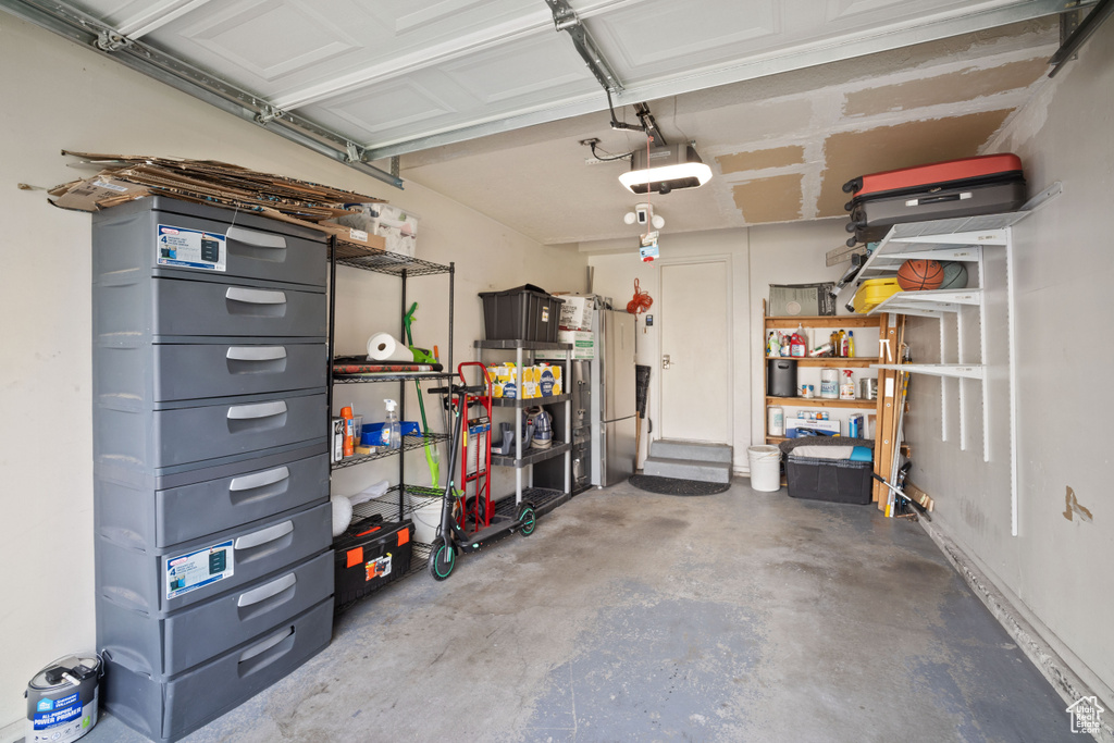 Garage featuring a garage door opener