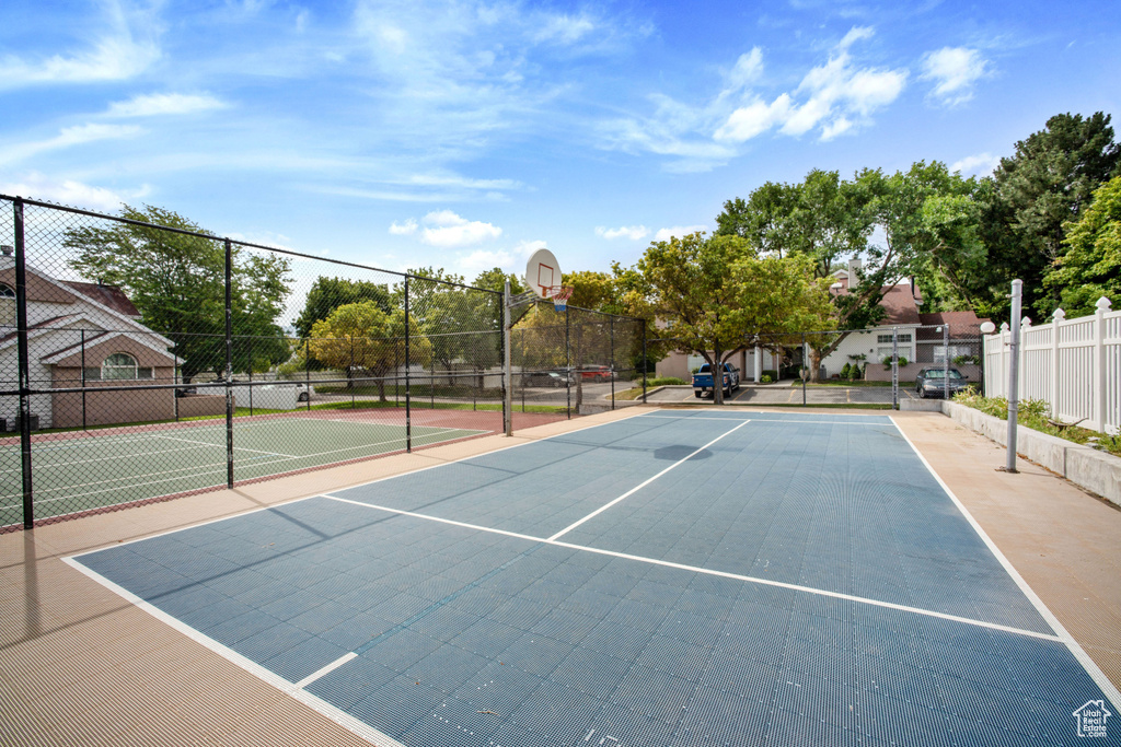 View of tennis court with community basketball court