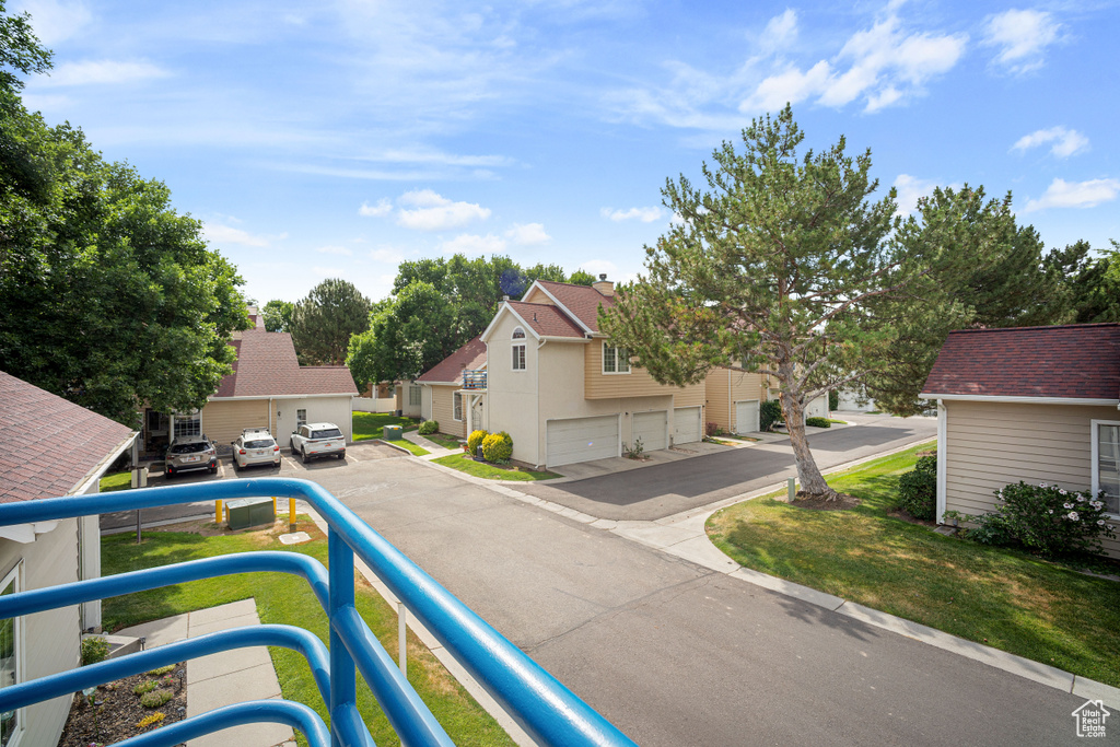 View of asphalt street featuring a residential view
